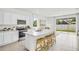 Modern kitchen with stainless steel appliances and island at 1540 Hammer Pl, Largo, FL 33774