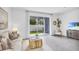 Living area with sliding doors and cozy seating at 1540 Hammer Pl, Largo, FL 33774