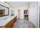 Spacious bathroom with double vanity, walk-in shower, and large closet at 15815 Muirfield Dr, Odessa, FL 33556