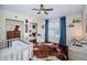 Charming Bedroom with hardwood floors, crib, and plenty of storage at 15815 Muirfield Dr, Odessa, FL 33556
