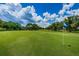 Expansive green golf course with lush trees and fairways at 15815 Muirfield Dr, Odessa, FL 33556
