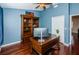 Bright home office with a large desk and built-in shelving at 15815 Muirfield Dr, Odessa, FL 33556