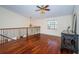 Open loft perfect for a sitting area, with hardwood floors at 15815 Muirfield Dr, Odessa, FL 33556