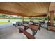 Covered picnic pavilion with multiple tables and benches at 15815 Muirfield Dr, Odessa, FL 33556