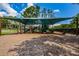 Shaded playground with play structures and picnic tables at 15815 Muirfield Dr, Odessa, FL 33556