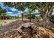 Community playground with shaded play structures, swings, and picnic tables at 15815 Muirfield Dr, Odessa, FL 33556