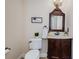 Elegant powder room with vanity and decorative mirror at 15815 Muirfield Dr, Odessa, FL 33556