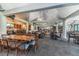 Clubhouse restaurant with tables and a bar area at 15815 Muirfield Dr, Odessa, FL 33556