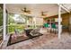Relaxing screened patio with seating area and a built-in bar at 15815 Muirfield Dr, Odessa, FL 33556