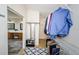 Large walk-in closet with ample shelving and hanging space at 15815 Muirfield Dr, Odessa, FL 33556