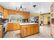 Kitchen with island and stainless steel appliances at 18032 Dew Bloom Dr, Hudson, FL 34667