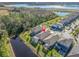 Aerial view of homes and community with lake at 18133 Aero Ave, Land O Lakes, FL 34638