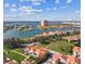 Aerial view of waterfront property with a vacant lot and surrounding homes at 21 Crescent S Pl, St Petersburg, FL 33711