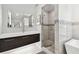 Elegant bathroom with a sleek vanity, walk-in shower, and modern fixtures at 21 Crescent S Pl, St Petersburg, FL 33711