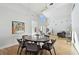 Elegant dining room with a round table and mid-century modern chairs at 21 Crescent S Pl, St Petersburg, FL 33711
