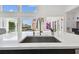 Modern kitchen with a large island and a view to the backyard at 21 Crescent S Pl, St Petersburg, FL 33711