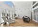 Open living room with hardwood floors, comfy seating, and lots of natural light at 21 Crescent S Pl, St Petersburg, FL 33711