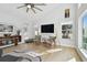 Comfortable living room featuring hardwood floors and abundant natural light at 21 Crescent S Pl, St Petersburg, FL 33711