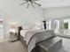 Spacious main bedroom with plush carpet and private access to balcony at 21 Crescent S Pl, St Petersburg, FL 33711
