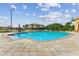 Inviting community pool with seating and umbrellas at 21 Crescent S Pl, St Petersburg, FL 33711