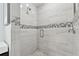 Large walk-in shower with pebble floor and modern tile at 21 Crescent S Pl, St Petersburg, FL 33711