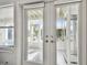 Sunroom with glass doors leading to an outdoor patio at 21 Crescent S Pl, St Petersburg, FL 33711