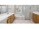 Elegant bathroom with double vanity, soaking tub, and separate shower at 3115 Bowfin Dr, Land O Lakes, FL 34639