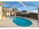 Private screened pool area with a tranquil lake view at 3115 Bowfin Dr, Land O Lakes, FL 34639