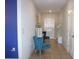 Clean hallway with tile floors and blue accent wall at 4208 Unbridled Song Dr, Ruskin, FL 33573