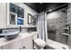 Updated bathroom with gray tile and glass sink at 4775 Cove Cir # 1105, St Petersburg, FL 33708