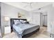 Main bedroom features a king-size bed, ceiling fan, and ample closet space at 501 Knights Run Ave # 2216, Tampa, FL 33602