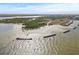 Aerial view of a tranquil beach with protective rock barriers at 509 Florida S Cir, Apollo Beach, FL 33572