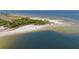 Aerial view of a secluded beach with calm waters at 509 Florida S Cir, Apollo Beach, FL 33572