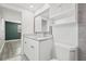 Modern bathroom with granite countertops and white cabinets at 509 Florida S Cir, Apollo Beach, FL 33572