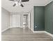 Spacious bedroom with wood-look floors and double door closet at 509 Florida S Cir, Apollo Beach, FL 33572