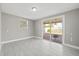 Bright bonus room with tile floors and sliding glass doors at 509 Florida S Cir, Apollo Beach, FL 33572