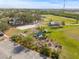Community garden with various plants, a shed, and parking at 509 Florida S Cir, Apollo Beach, FL 33572