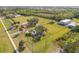 Dog park with grassy areas and seating at 509 Florida S Cir, Apollo Beach, FL 33572