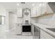 Modern kitchen with granite counters and stainless steel appliances at 509 Florida S Cir, Apollo Beach, FL 33572