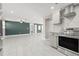 Modern kitchen with stainless steel appliances and tile floors at 509 Florida S Cir, Apollo Beach, FL 33572