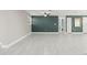 Open concept living area with tile flooring and an accent wall at 509 Florida S Cir, Apollo Beach, FL 33572