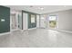 Bright and airy living room with tile floors and an accent wall at 509 Florida S Cir, Apollo Beach, FL 33572
