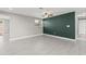 Spacious living room with tile floors and an accent wall at 509 Florida S Cir, Apollo Beach, FL 33572