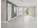 Open concept living room with tile flooring and natural light at 509 Florida S Cir, Apollo Beach, FL 33572