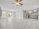 Open living room with tile floors and modern kitchen at 509 Florida S Cir, Apollo Beach, FL 33572