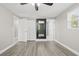 Main bedroom with wood-look floors and full bathroom access at 509 Florida S Cir, Apollo Beach, FL 33572