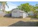 White storage shed in backyard at 509 Florida S Cir, Apollo Beach, FL 33572