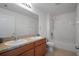 Bathroom with double sinks, shower, and tub at 5119 11Th E St, Bradenton, FL 34203