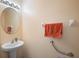 Clean bathroom with pedestal sink and grab bar at 5119 11Th E St, Bradenton, FL 34203