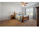 Charming bedroom with wooden bed frame and window at 5119 11Th E St, Bradenton, FL 34203